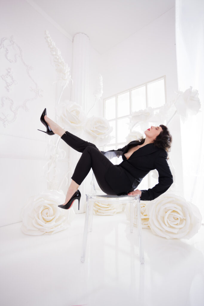 Berlin Dominatrix Lady Vyra in a black suit and black high heels