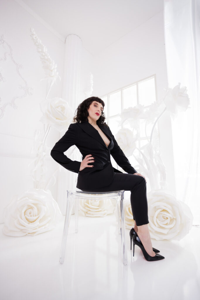 Berlin Dominatrix Lady Vyra in a black suit and black high heels