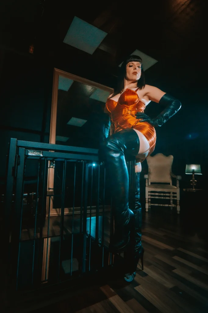 Berlin Domina Lady Vyra in a Bordelle lingerie dress and black leather overknee boots